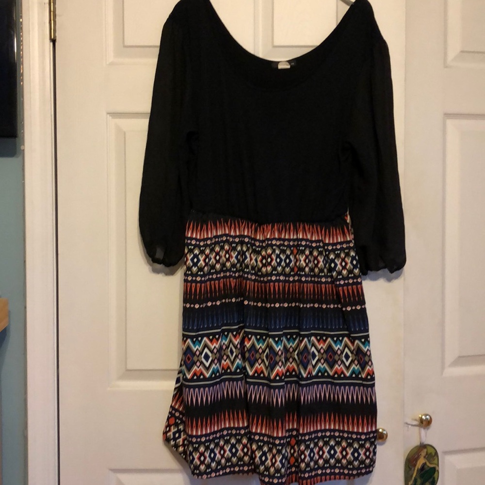 Long sleeved Black dress with patterned skirt